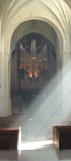 organ in the nave of church solesmes